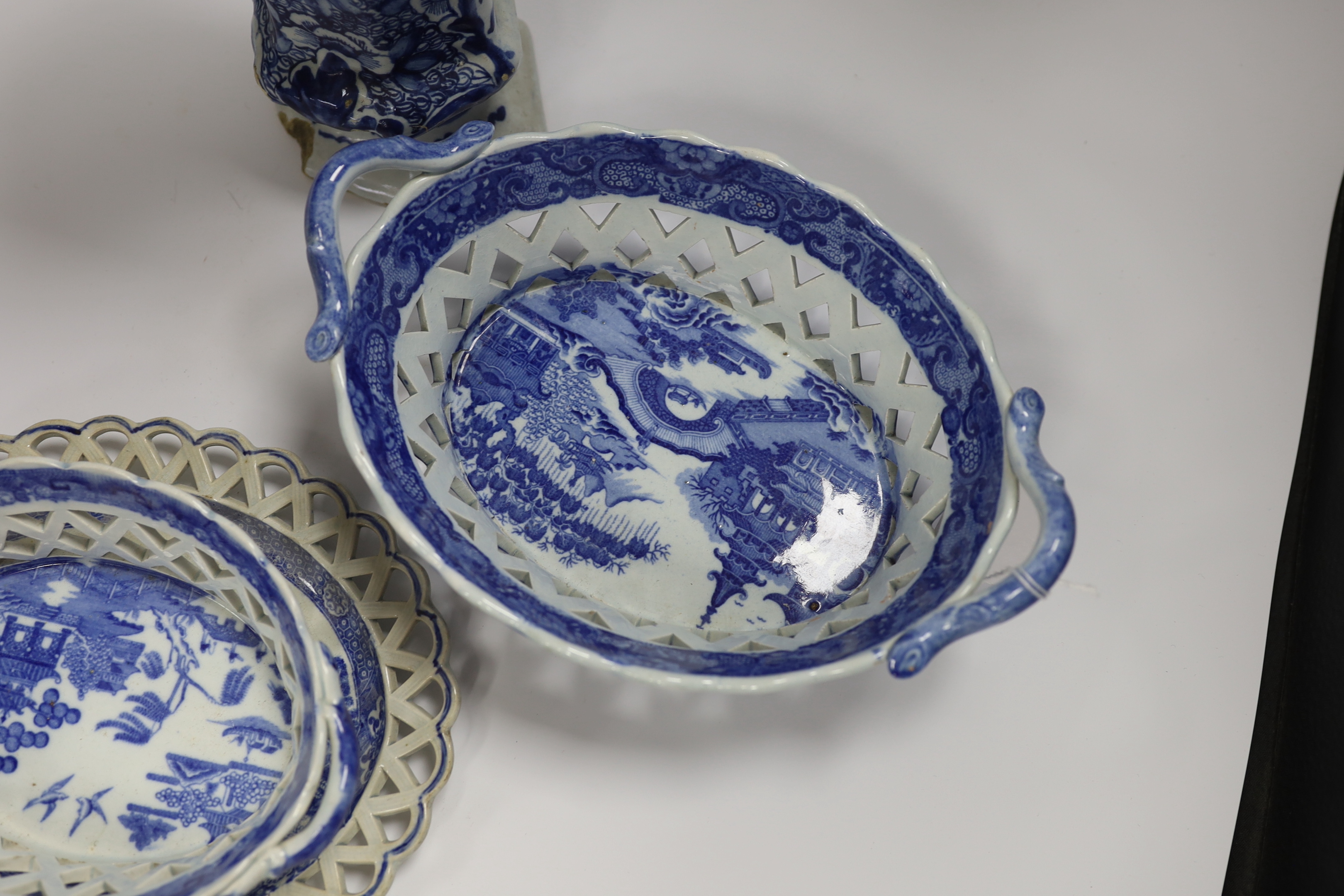 An 18th century hexagonal Delft vase, two pearlware blue and white baskets and a similar dish, tallest 27cm